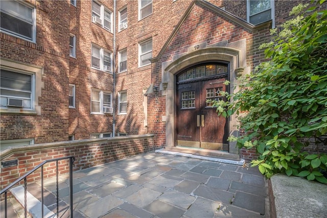 doorway to property featuring cooling unit