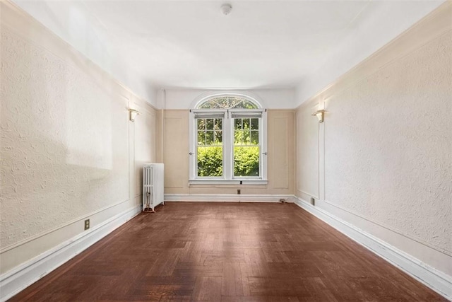 empty room featuring radiator heating unit