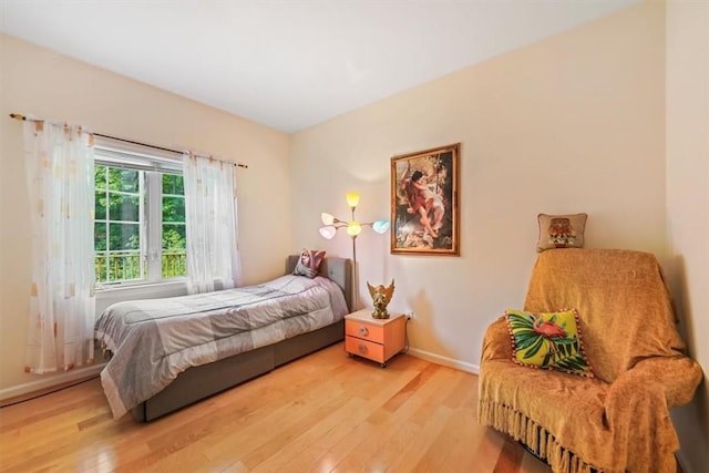 bedroom with hardwood / wood-style flooring