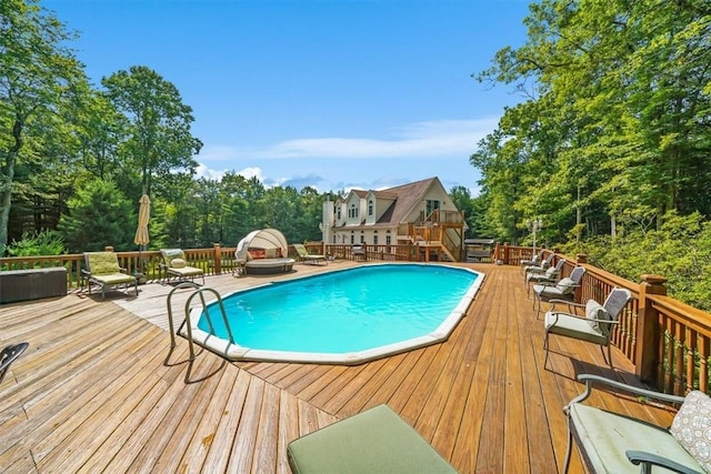 view of pool featuring a wooden deck