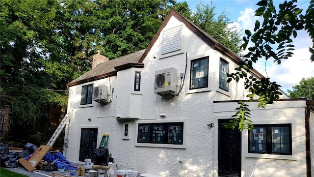 view of front of property featuring ac unit