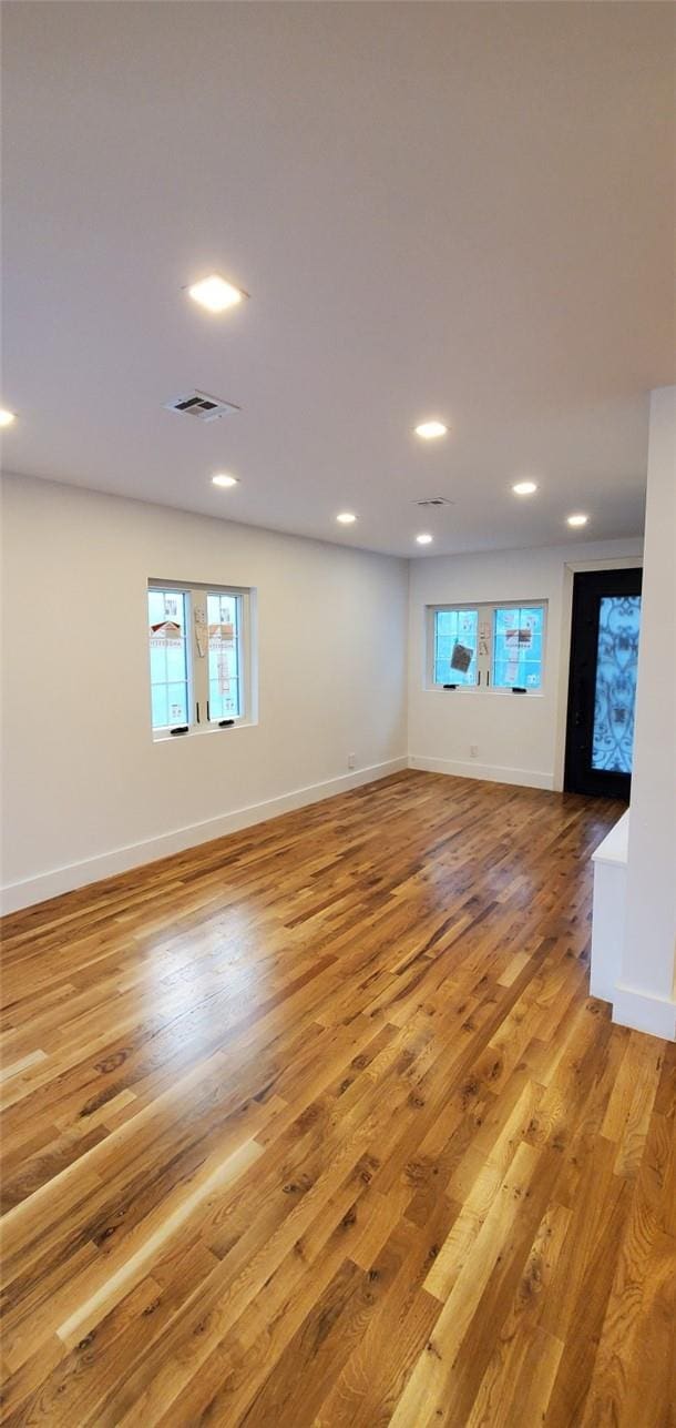 unfurnished living room featuring light wood-type flooring