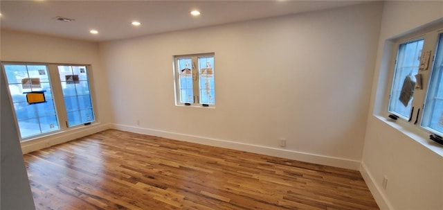 empty room featuring hardwood / wood-style flooring