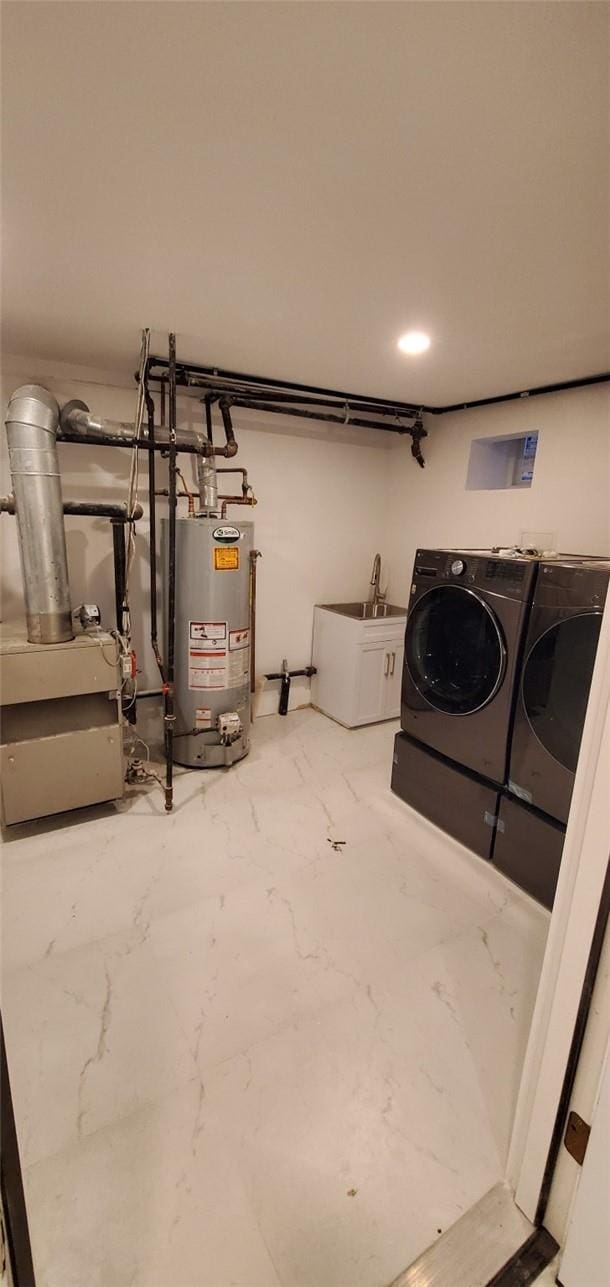 laundry area with washer and clothes dryer and gas water heater