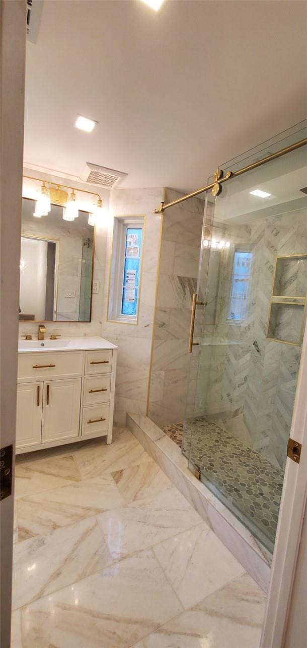 bathroom featuring vanity and walk in shower