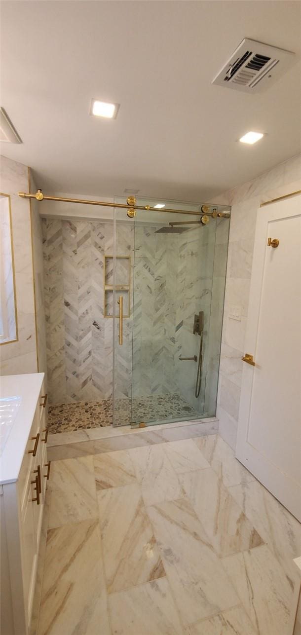 bathroom with vanity and walk in shower