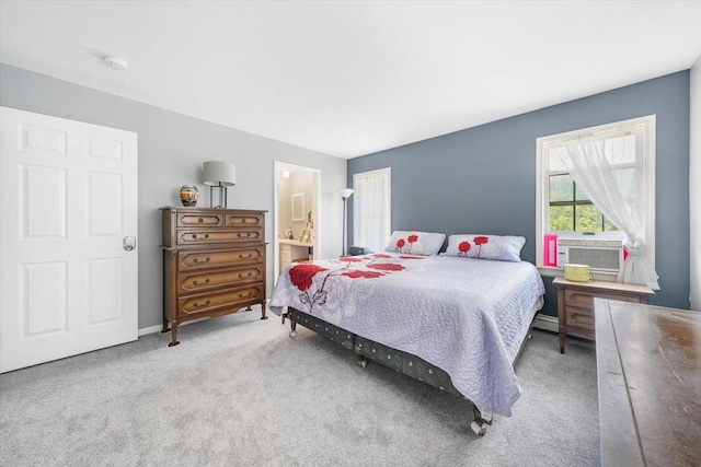 carpeted bedroom with ensuite bathroom