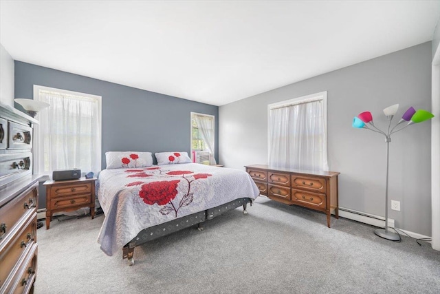 carpeted bedroom featuring a baseboard radiator