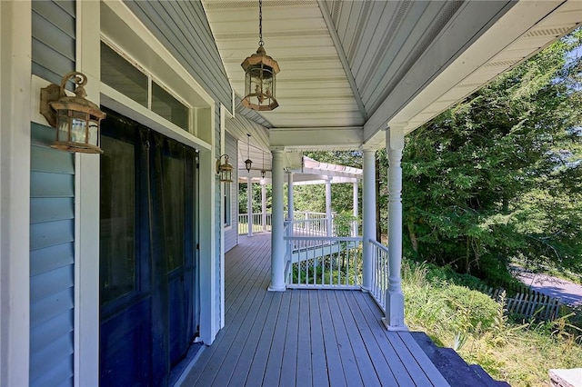 wooden terrace featuring covered porch