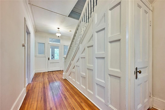 interior space with crown molding and hardwood / wood-style floors