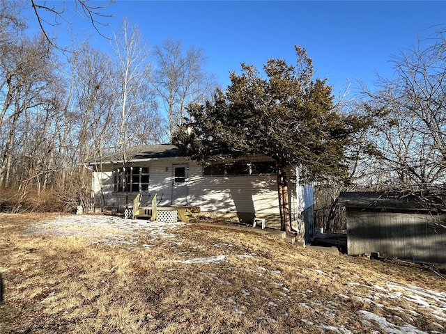 rear view of house featuring a deck