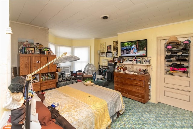 bedroom with crown molding