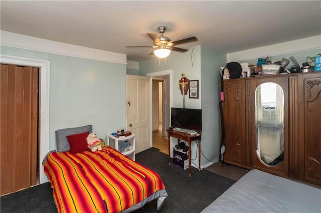 carpeted bedroom with ceiling fan