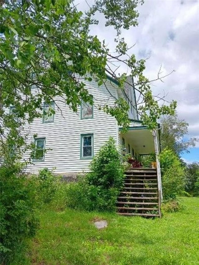 view of home's exterior featuring a yard