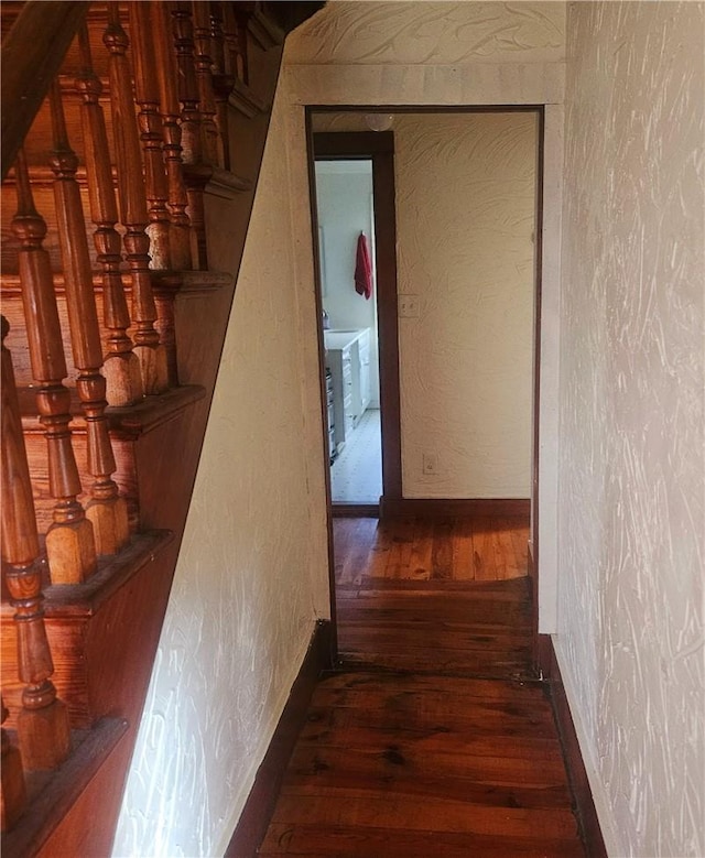 hall with dark hardwood / wood-style floors