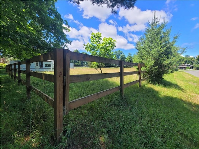 view of gate featuring a yard