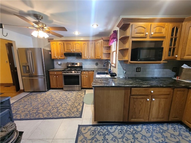 kitchen with decorative backsplash, stainless steel appliances, ceiling fan, sink, and light tile patterned flooring