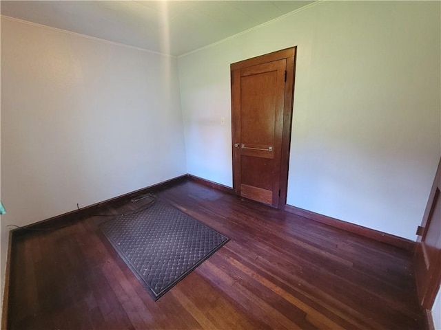 empty room featuring dark hardwood / wood-style flooring