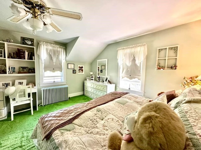 carpeted bedroom with ceiling fan, radiator heating unit, and vaulted ceiling