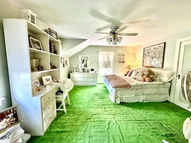 bedroom with carpet flooring, vaulted ceiling, and ceiling fan