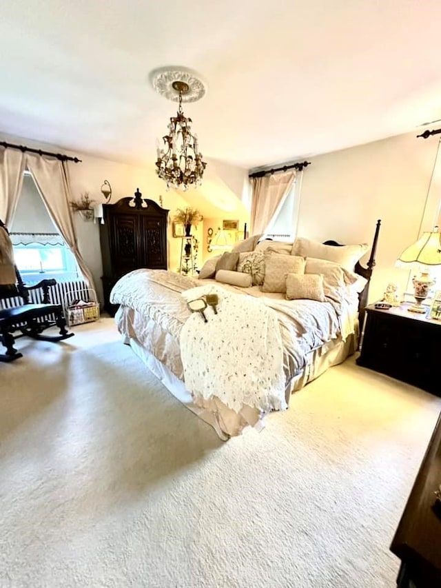 bedroom with carpet and a chandelier