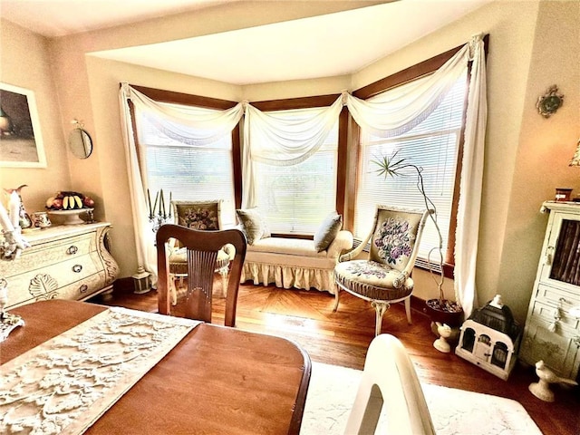 sitting room with dark wood-type flooring