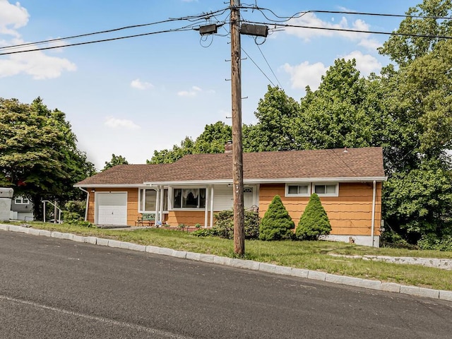 single story home with a garage