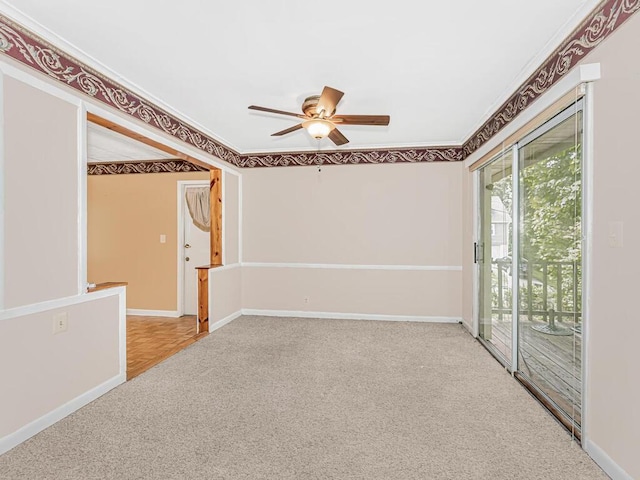 carpeted empty room featuring ceiling fan and ornamental molding