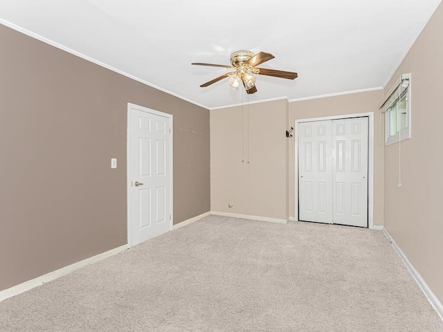 unfurnished bedroom with ceiling fan, light carpet, and ornamental molding