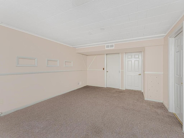 basement with carpet flooring and crown molding