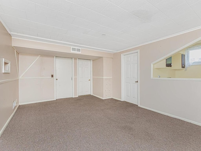 interior space with carpet flooring and ornamental molding