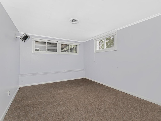 carpeted spare room with ornamental molding