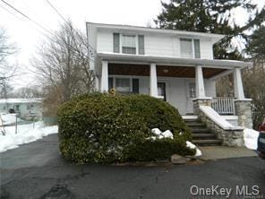 view of front property featuring covered porch