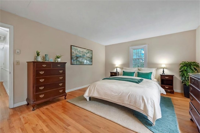 bedroom with light hardwood / wood-style flooring