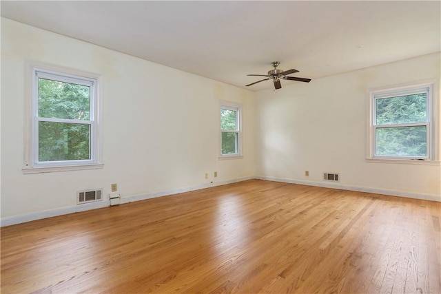 spare room featuring ceiling fan and light hardwood / wood-style floors