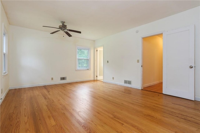 unfurnished room with ceiling fan and light wood-type flooring