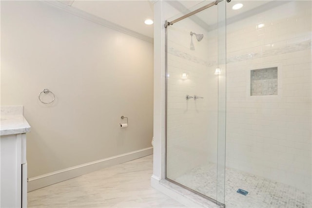 bathroom with vanity, toilet, an enclosed shower, and crown molding