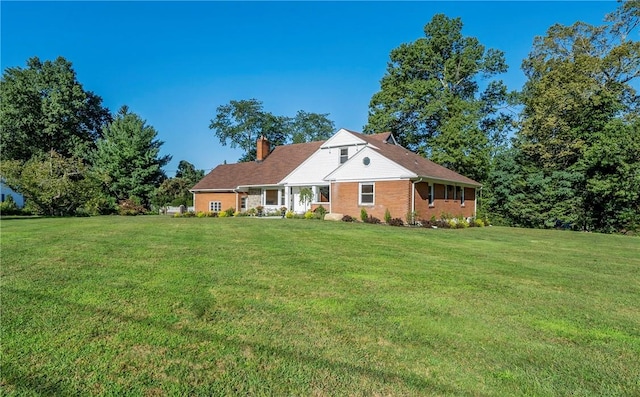 new england style home featuring a front yard