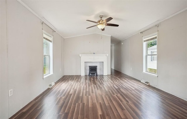 unfurnished living room with dark hardwood / wood-style floors, vaulted ceiling, ceiling fan, and ornamental molding