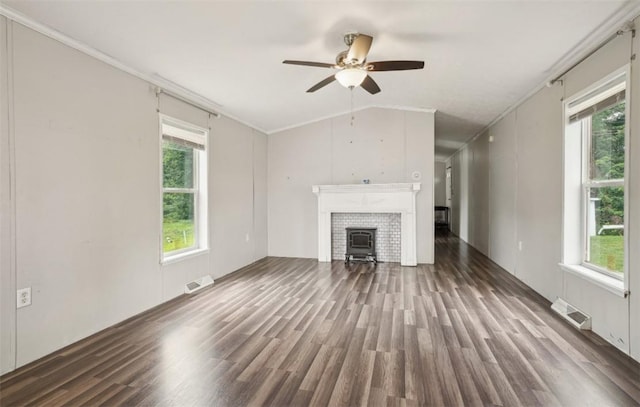 unfurnished living room featuring ornamental molding, dark hardwood / wood-style flooring, ceiling fan, and lofted ceiling