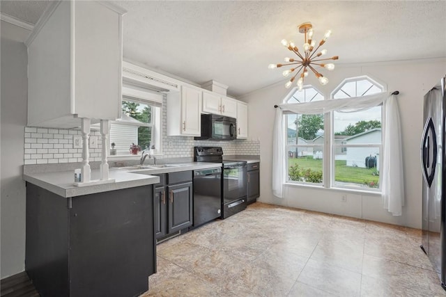 kitchen featuring backsplash, a textured ceiling, black appliances, an inviting chandelier, and white cabinetry