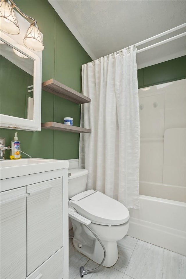 full bathroom with vanity, shower / tub combo, and toilet