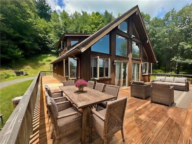 wooden terrace featuring an outdoor living space