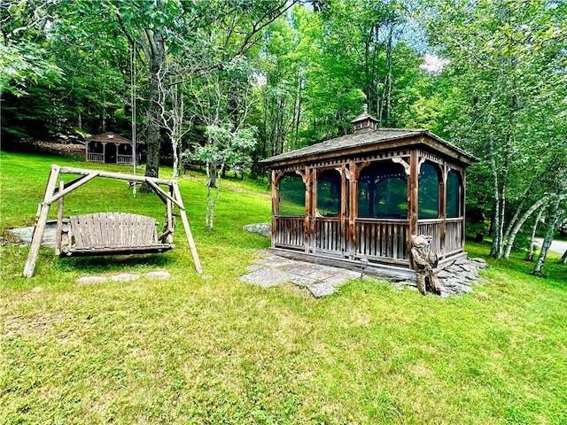 view of yard featuring a gazebo and an outdoor structure