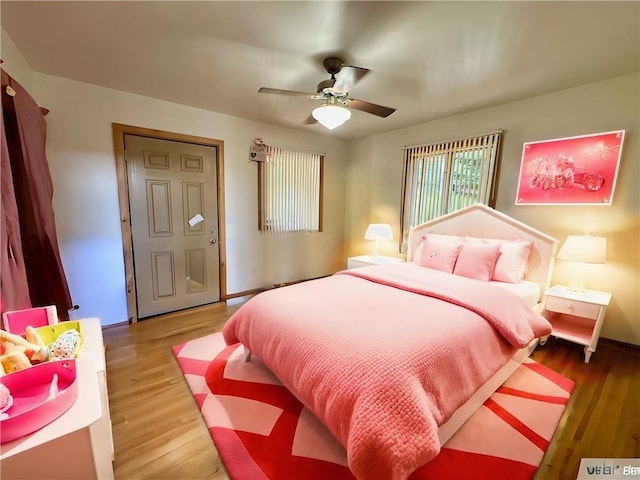 bedroom featuring hardwood / wood-style floors and ceiling fan