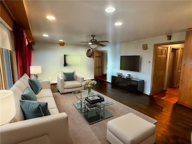 living room featuring ceiling fan and hardwood / wood-style floors