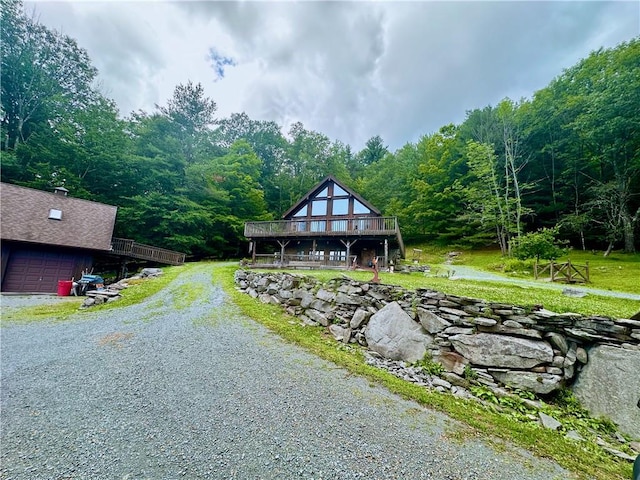 view of front of house with a garage and a deck