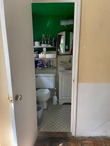 bathroom with tile patterned floors and toilet