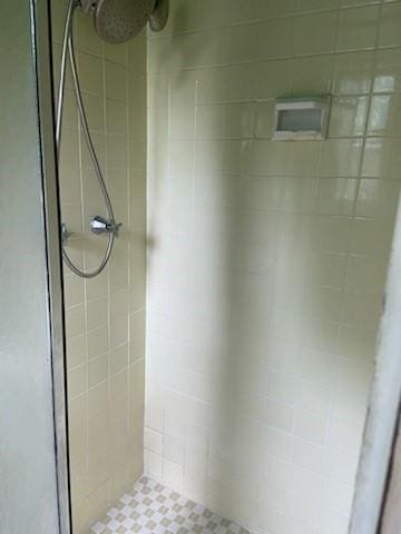 bathroom with a tile shower