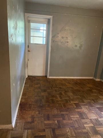 doorway featuring dark parquet floors